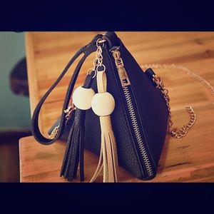 Black triangle purse with tassels